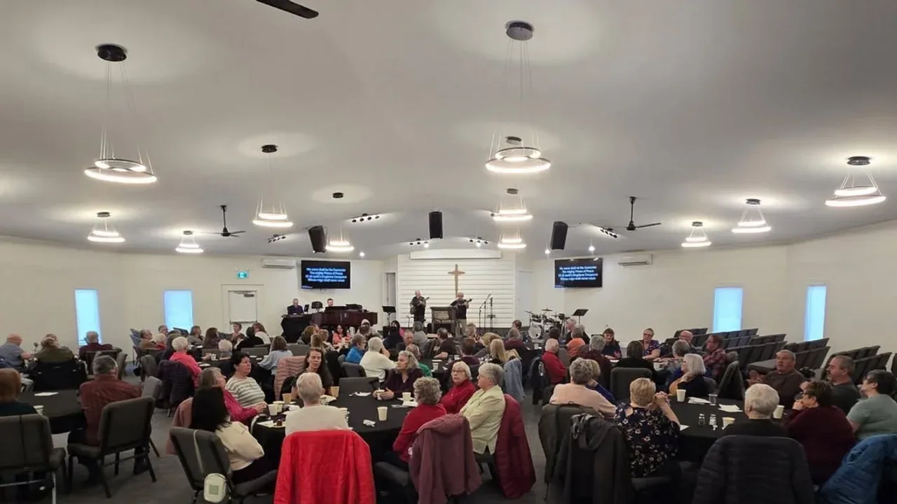 Calvary church family gathered around tables for fellowship