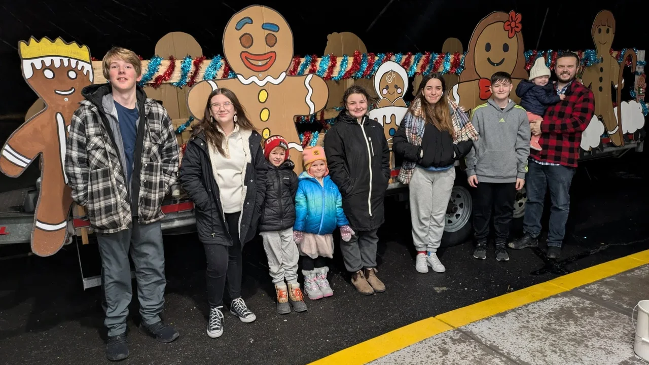 Children, teenagers, and adults participating in a Christmas community activity