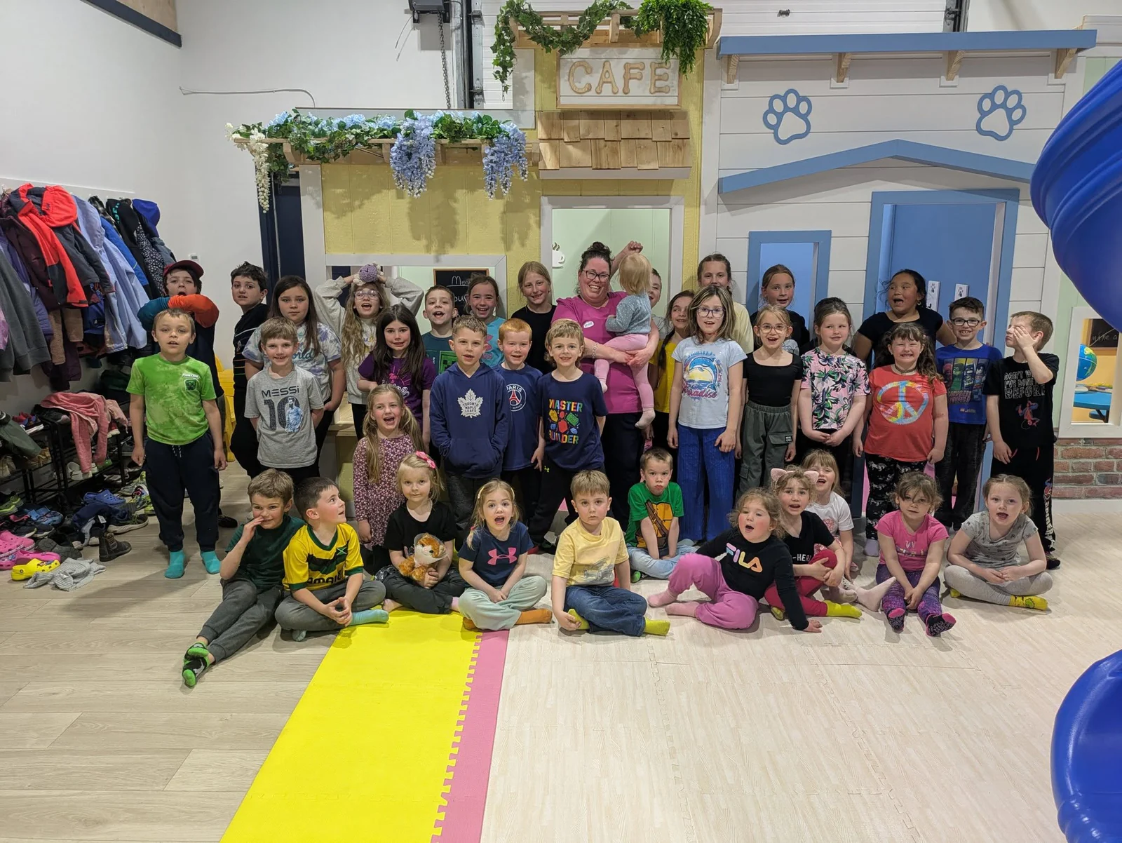 Children and ministry leaders smiling together in the Calvary Next Gen room